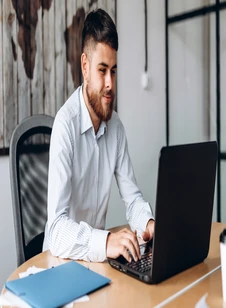IT professional working on a business laptop